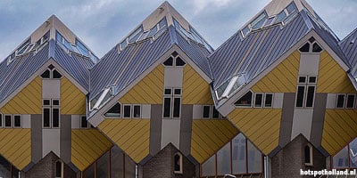 De tweede generatie Kubuswoningen in Rotterdam zijn geel. Die in Helmond zijn groen